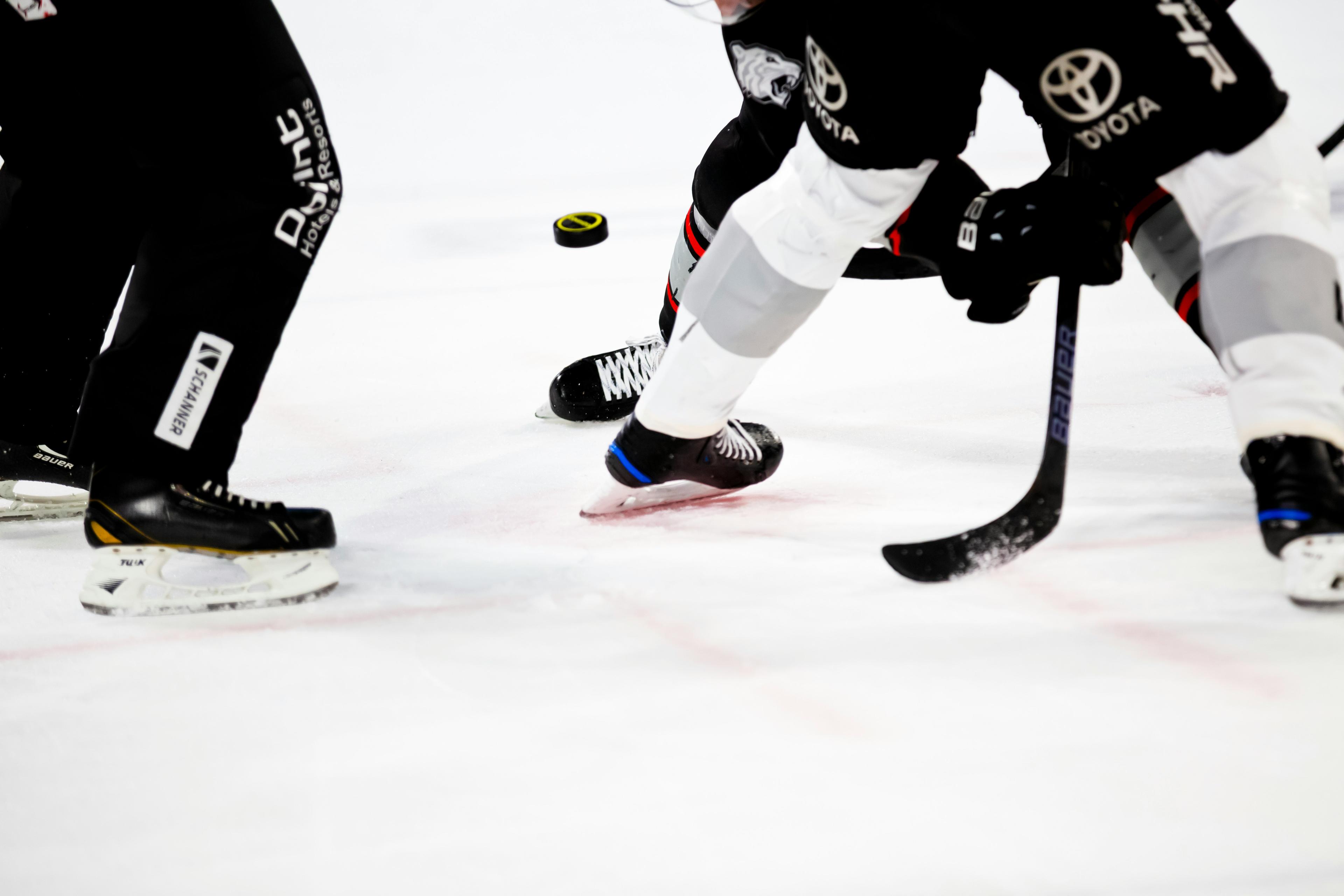 Hockey face-off on the ice — team sport in motion